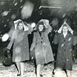More Coming, Pearl Reep, Belle Dodds, and Ruth Hassen, All of Flushing, Covering Their Heads as They Walk Along Chambers St., February 1946 // Bernie Aumuller<br/>